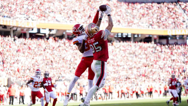 Oct 23, 2022; Santa Clara, California, USA; San Francisco 49ers tight end George Kittle (85) catches a touchdown pass next to Kansas City Chiefs cornerback Jaylen Watson (35) in the fourth quarter at Levi's Stadium. Mandatory Credit: Cary Edmondson-USA TODAY Sports  